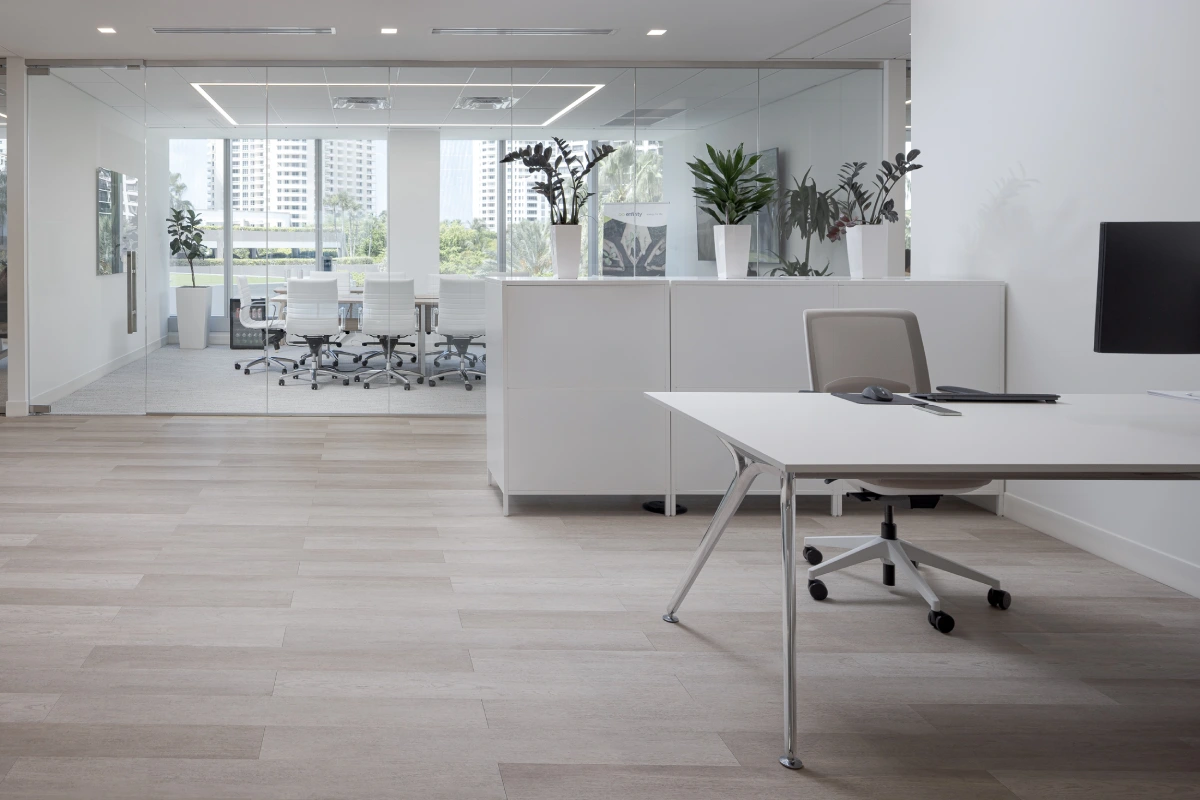 Enfinity Spec Suite open consulting space with sleek white finishes, built-in cabinetry, and natural light for a fresh clinical feel